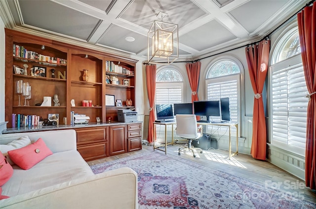 office featuring coffered ceiling, beam ceiling, light hardwood / wood-style flooring, and ornamental molding