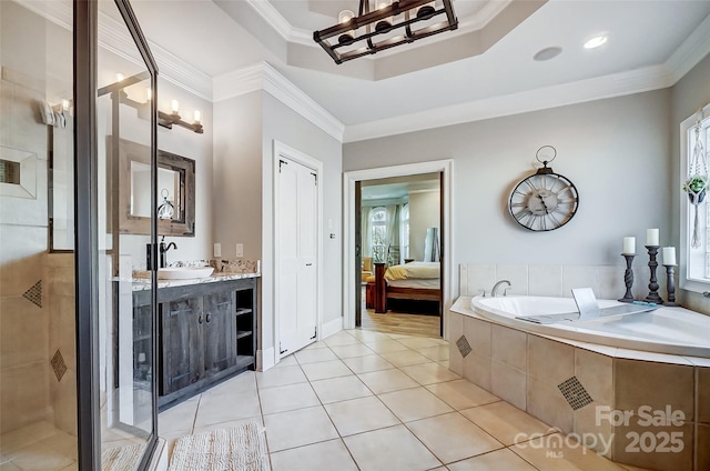 bathroom featuring crown molding, vanity, shower with separate bathtub, and tile patterned flooring