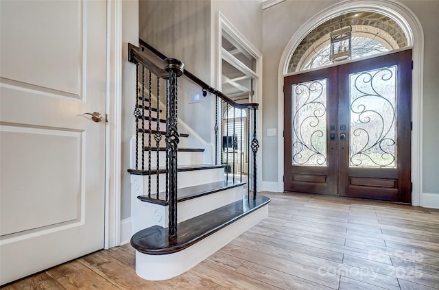 entryway featuring light hardwood / wood-style floors and french doors