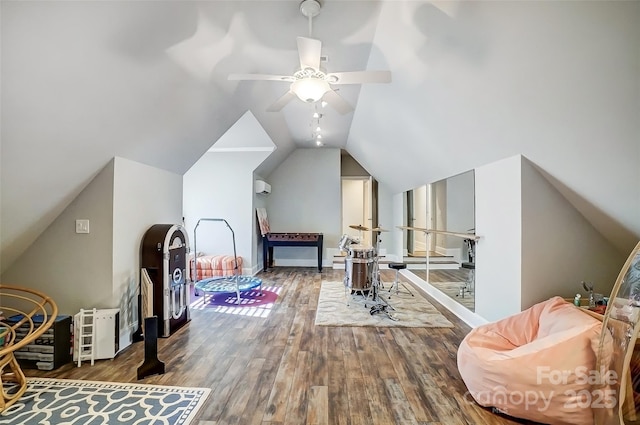 interior space with hardwood / wood-style flooring and vaulted ceiling