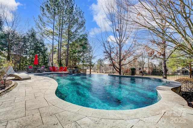 view of swimming pool featuring a patio and pool water feature