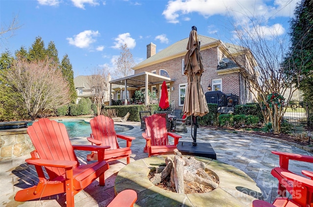 view of patio / terrace with an outdoor fire pit