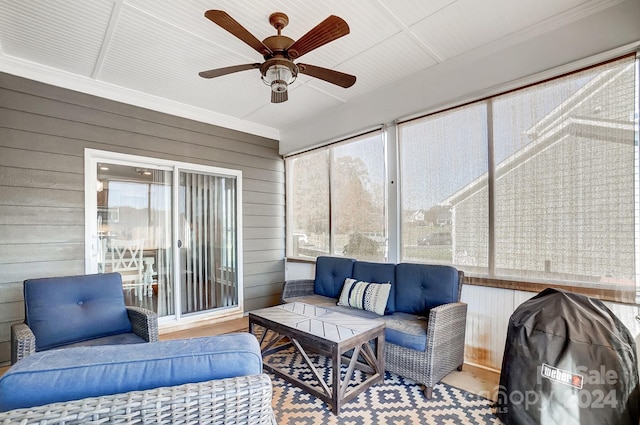 sunroom / solarium with ceiling fan