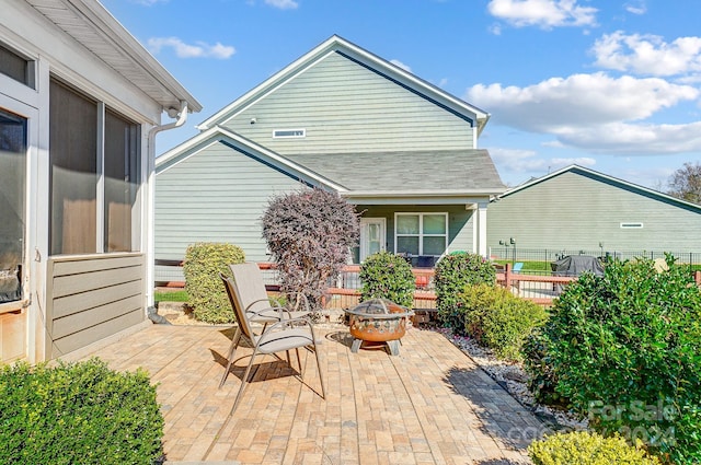 view of patio / terrace featuring an outdoor fire pit