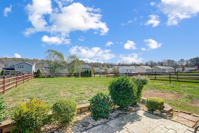 view of yard with a patio area and a rural view