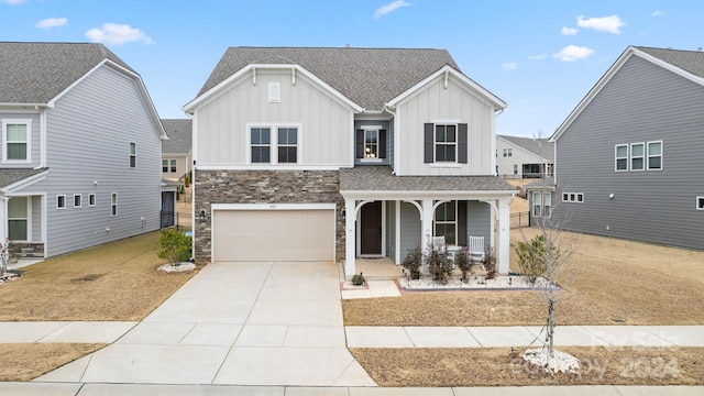 view of front of home with a porch and a garage