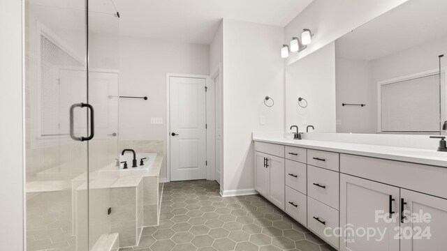 bathroom featuring tile patterned floors, vanity, and independent shower and bath