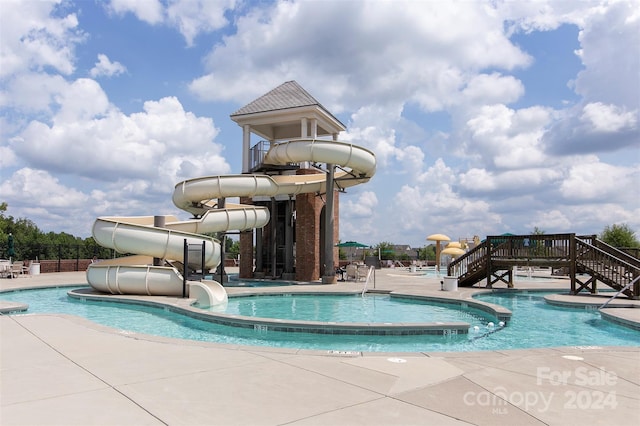 view of pool featuring a water slide