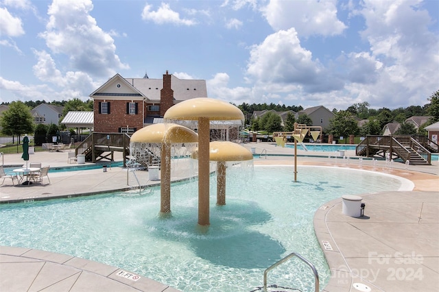 view of pool featuring a patio and pool water feature