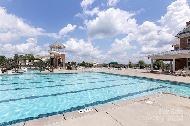 view of swimming pool with a patio area