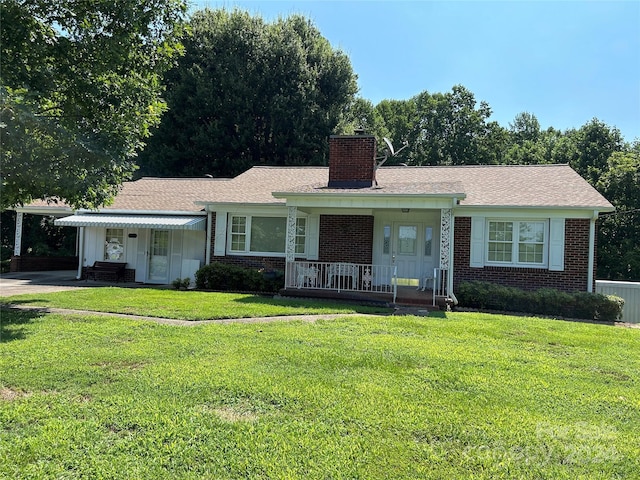 ranch-style house with a porch and a front yard