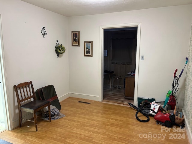 living area with light hardwood / wood-style flooring