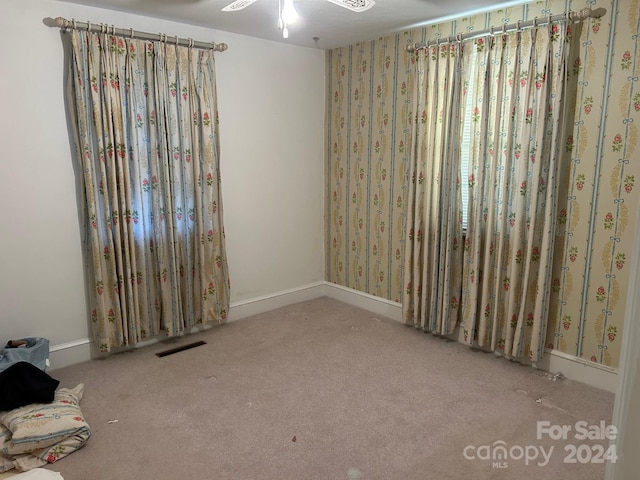 empty room with light colored carpet