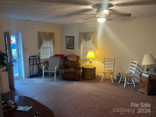 sitting room with carpet flooring and ceiling fan