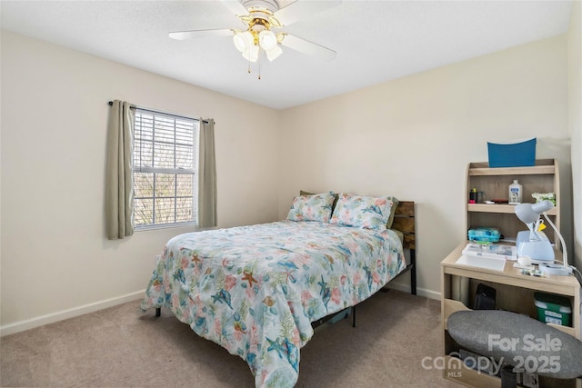 bedroom with carpet flooring, baseboards, and a ceiling fan