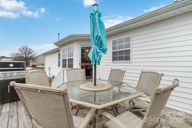 deck with outdoor dining area