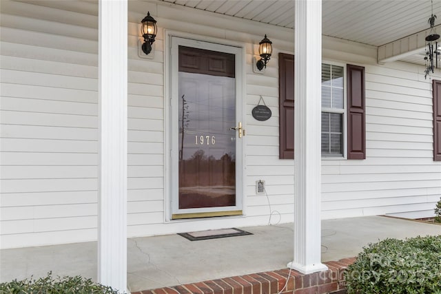 doorway to property with a porch