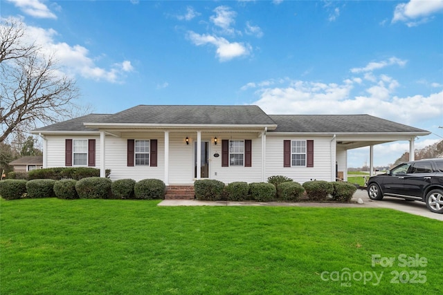 view of front of property with a carport, a front lawn, a porch, concrete driveway, and roof with shingles