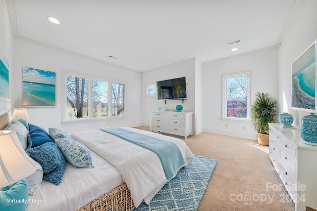 carpeted bedroom featuring multiple windows and ornamental molding