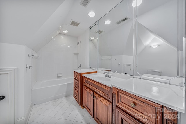 full bathroom featuring tile patterned floors, tiled shower / bath combo, vanity, toilet, and lofted ceiling