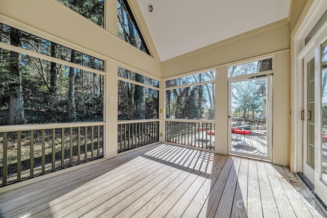 unfurnished sunroom with vaulted ceiling