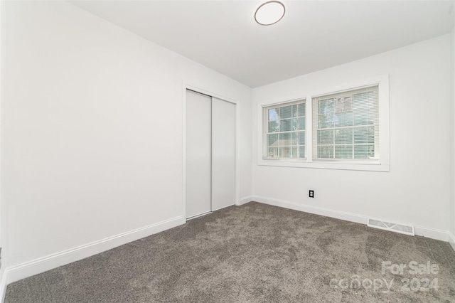 empty room featuring carpet flooring