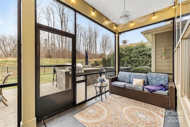 sunroom / solarium with ceiling fan