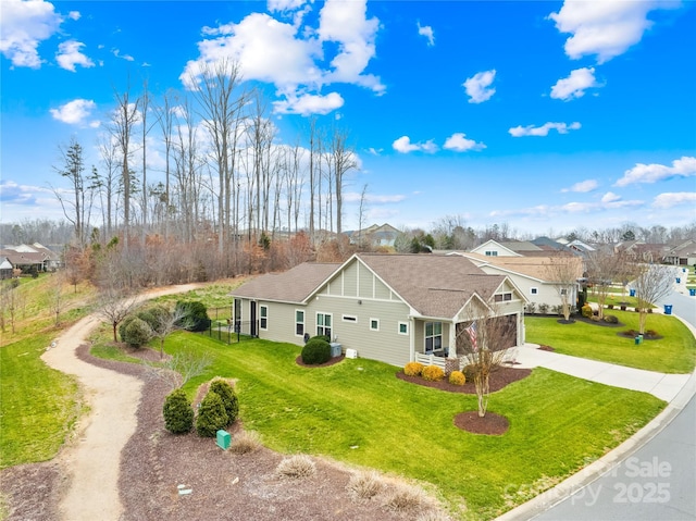 view of side of home with a yard