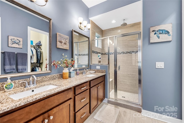 bathroom with vanity and an enclosed shower