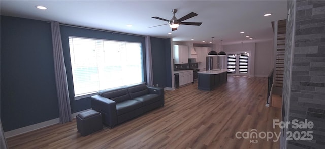 327 Coxe Ave, Charlotte, NC 28208 - living room with plenty of natural light, wood finished floors, a ceiling fan, and recessed lighting