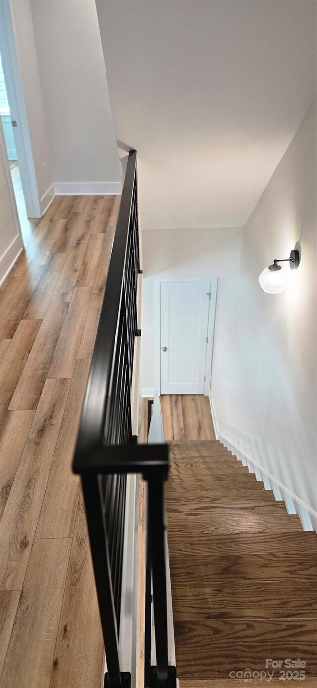 327 Coxe Ave, Charlotte, NC 28208 - stairs featuring wood finished floors and baseboards