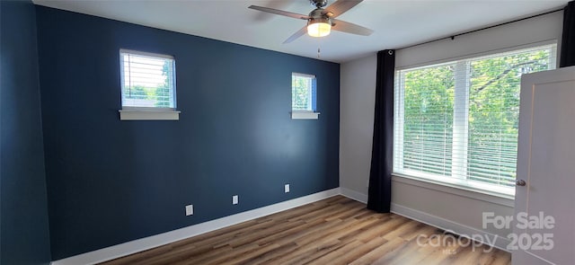 327 Coxe Ave, Charlotte, NC 28208 - unfurnished room featuring wood finished floors, baseboards, and ceiling fan