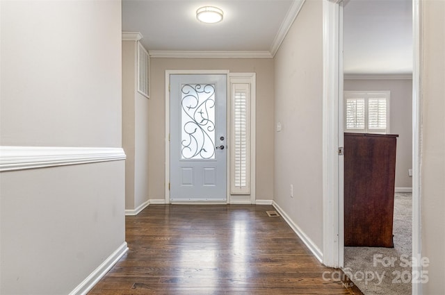 entrance foyer with dark hardwood / wood-style floors and ornamental molding