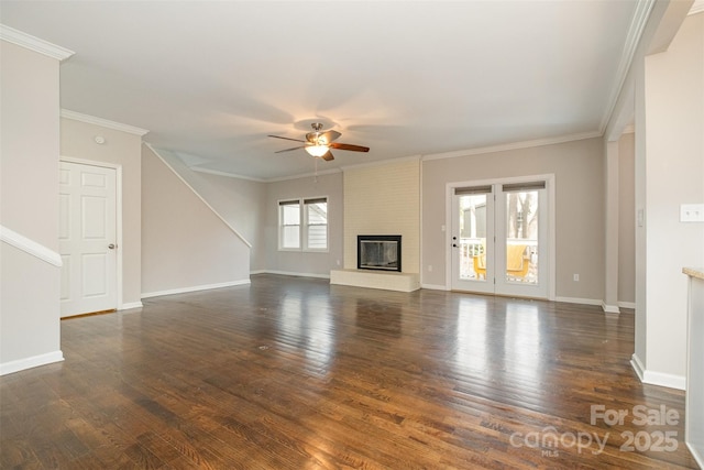 unfurnished living room with ceiling fan, a fireplace, dark wood-type flooring, and ornamental molding