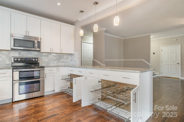 kitchen featuring dark wood-type flooring, appliances with stainless steel finishes, tasteful backsplash, decorative light fixtures, and white cabinetry