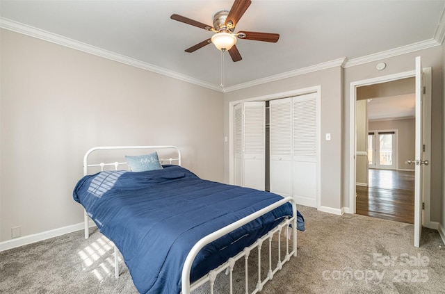 bedroom featuring carpet flooring, a closet, ceiling fan, and crown molding