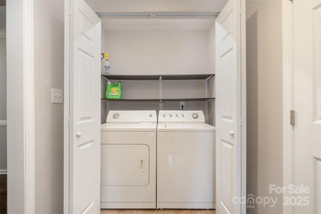 clothes washing area featuring separate washer and dryer