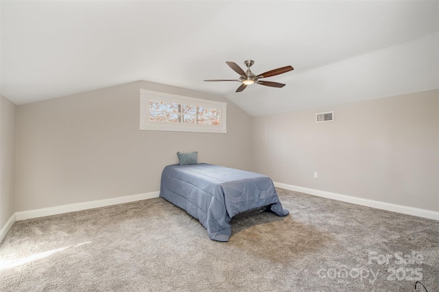 carpeted bedroom with ceiling fan and lofted ceiling