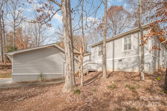 view of home's exterior with a deck