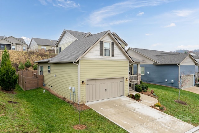 view of property exterior with a garage and a yard