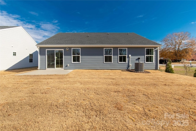 back of house featuring a yard and a patio