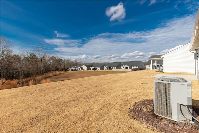 view of yard with central AC