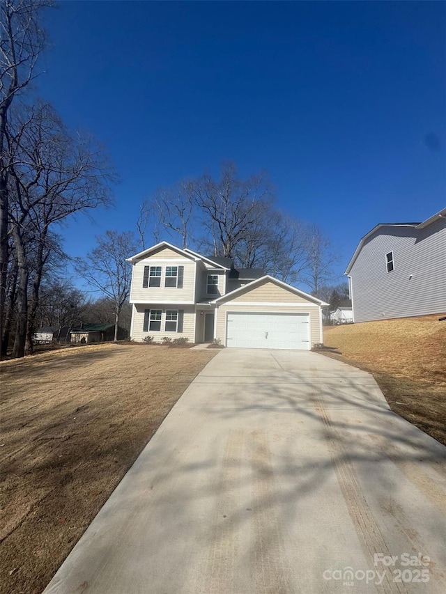 view of front facade featuring a garage and a front lawn