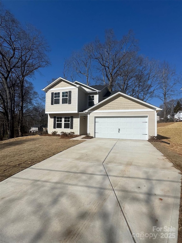 view of front of property with a garage and a front lawn