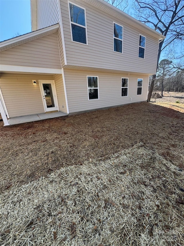 rear view of property featuring a patio