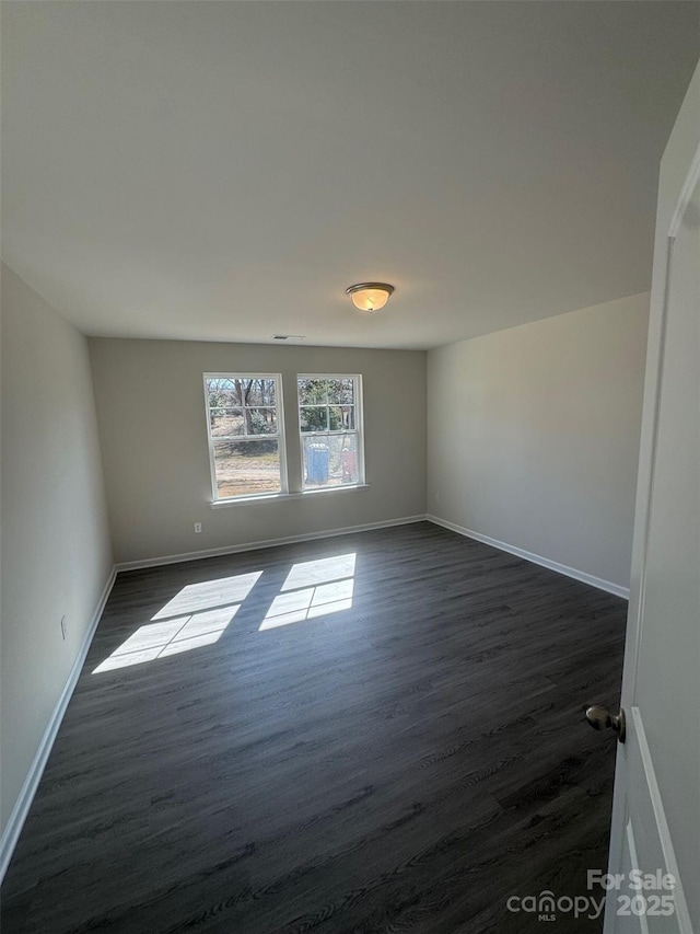 empty room featuring dark hardwood / wood-style floors