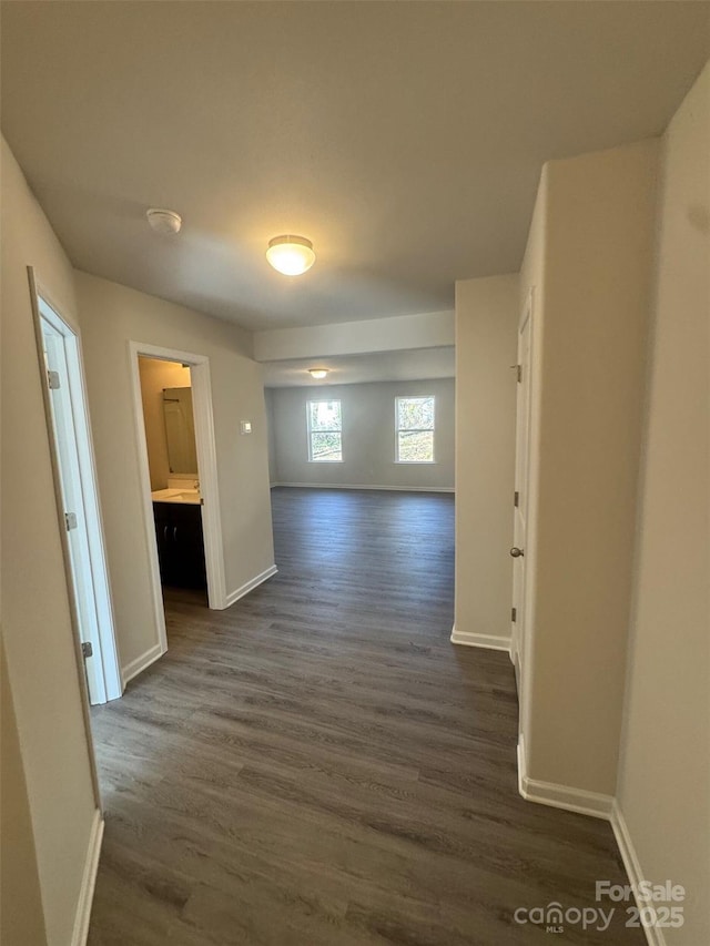 hall with dark wood-type flooring