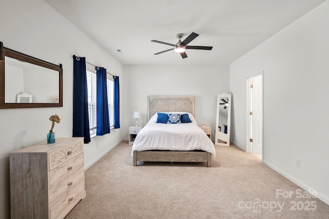 carpeted bedroom with ceiling fan, visible vents, and baseboards