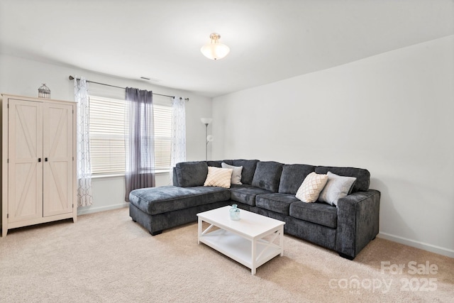 living area featuring carpet floors, visible vents, and baseboards