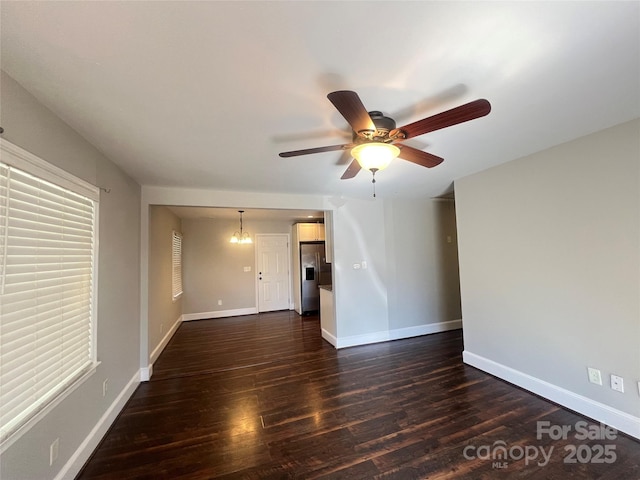 interior space featuring dark wood-style floors, baseboards, and a ceiling fan